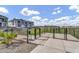 A dog park with a black metal fence is a great place to let your furry friend run and play at 8149 E Petunia Ave # 1042, Mesa, AZ 85212