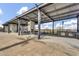 Exterior kitchen and gathering space with bar, grills, fireplace, and neighborhood views at 8149 E Petunia Ave # 1042, Mesa, AZ 85212