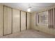 Bedroom with a sliding closet, neutral carpet, and a window providing natural light at 8337 E Desert Trl, Mesa, AZ 85208