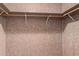 Empty closet featuring shelving and hanging racks for clothes and storage at 8337 E Desert Trl, Mesa, AZ 85208