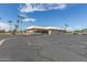 Exterior of community clubhouse with golf carts, parking and palm trees at 8337 E Desert Trl, Mesa, AZ 85208