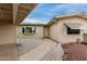 Inviting front entrance with a walkway, desert landscaping, and neutral siding at 8337 E Desert Trl, Mesa, AZ 85208