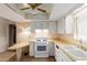Functional kitchen featuring white appliances, cabinets, and linoleum countertop at 8337 E Desert Trl, Mesa, AZ 85208