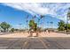 Memorial square featuring flags, landscaping, benches, and an open space with desert scenery at 8337 E Desert Trl, Mesa, AZ 85208
