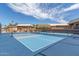 Outdoor pickleball court featuring a blue surface and a well-maintained net for recreational community activities at 8337 E Desert Trl, Mesa, AZ 85208