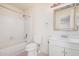 Bright bathroom with a shower-tub combination, white vanity, and tile flooring at 870 S Palm Ln # 55, Chandler, AZ 85225