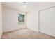 Cozy bedroom features a ceiling fan, a window view, and plush carpeting at 870 S Palm Ln # 55, Chandler, AZ 85225