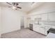 Well-lit kitchen features a ceiling fan, ample cabinet space, and tiled floors at 870 S Palm Ln # 55, Chandler, AZ 85225