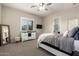 Comfortable bedroom with neutral carpet, white dresser, and a cozy bed with soft bedding at 9281 W Villa Chula --, Peoria, AZ 85383