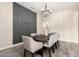 Dining room featuring a large wooden table, chandelier, and accent wall at 9281 W Villa Chula --, Peoria, AZ 85383