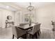 Formal dining room with modern lighting and seating for eight at 9281 W Villa Chula --, Peoria, AZ 85383