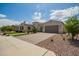 Charming home with a tile roof, two-car garage, and desert landscaping at 9281 W Villa Chula --, Peoria, AZ 85383