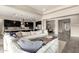 Open-concept living area showcasing a comfortable sectional sofa, modern lighting, and seamless flow to kitchen and dining at 9281 W Villa Chula --, Peoria, AZ 85383