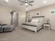 Serene main bedroom featuring a comfortable bed, soft lighting, and cozy seating area at 9281 W Villa Chula --, Peoria, AZ 85383
