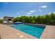 Backyard pool featuring a spa, lush landscaping, and covered lounge area, perfect for outdoor entertaining at 9281 W Villa Chula --, Peoria, AZ 85383