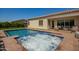Resort-style pool and hot tub with lush landscaping and patio seating at 9281 W Villa Chula --, Peoria, AZ 85383