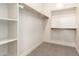 Walk-in closet with built-in shelves and wood rods for ample storage at 9281 W Villa Chula --, Peoria, AZ 85383