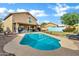 Large backyard boasting a refreshing pool, covered patio, and ample space for outdoor living at 1215 W Wahalla W Ln, Phoenix, AZ 85027