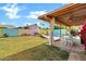 Charming backyard featuring covered patio, seating, pool, and colorful privacy fence at 1215 W Wahalla W Ln, Phoenix, AZ 85027