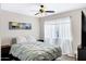 Cozy bedroom with a ceiling fan, large bed, and bright natural light at 1215 W Wahalla W Ln, Phoenix, AZ 85027