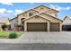 Charming two-story home with lush green lawn and a spacious three-car garage at 1215 W Wahalla W Ln, Phoenix, AZ 85027