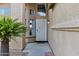 Inviting front porch with decorative security door and mature desert landscaping at 1215 W Wahalla W Ln, Phoenix, AZ 85027