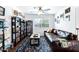 Comfortable living room with a leather sofa, bookshelves, and a decorative rug at 1215 W Wahalla W Ln, Phoenix, AZ 85027