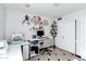 Bright office space featuring built-in shelves, ample desk space, and neutral tile flooring at 1215 W Wahalla W Ln, Phoenix, AZ 85027