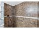 Tiled shower with a glass block window and convenient grab bar at 1215 W Wahalla W Ln, Phoenix, AZ 85027