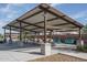 Large community ramada perfect for group gatherings with picnic tables, seating, and BBQ grills at 12721 W Corona Ave, Avondale, AZ 85323