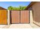 A wooden gate in the backyard, offering privacy and security at 14208 W Larkspur Dr, Surprise, AZ 85379