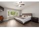 Bright main bedroom suite with a bay window and warm tones creating a relaxing retreat at 14208 W Larkspur Dr, Surprise, AZ 85379