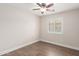 Bedroom with ceiling fan and window at 14208 W Larkspur Dr, Surprise, AZ 85379