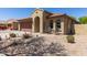Single Gathering home showcasing well maintained desert landscape and a two car garage at 14208 W Larkspur Dr, Surprise, AZ 85379