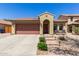Single Gathering home showcasing a well maintained desert landscape and a two car garage at 14208 W Larkspur Dr, Surprise, AZ 85379