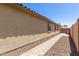 Paver walkway highlights the exterior of this home that is beautifully landscaped with mature trees and plants at 14208 W Larkspur Dr, Surprise, AZ 85379