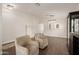 Open living room with modern lighting, vinyl flooring, and decorative accents at 14208 W Larkspur Dr, Surprise, AZ 85379