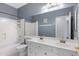 Bathroom with double vanity, tub and shower combo providing practical use of space, complemented by neutral walls at 14801 S 8Th St, Phoenix, AZ 85048