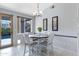 Charming dining area with chandelier, backyard access, and natural light at 14801 S 8Th St, Phoenix, AZ 85048