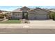 Charming single-Gathering home with a well-manicured lawn, desert landscaping, and a two-car garage at 14801 S 8Th St, Phoenix, AZ 85048