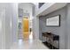 Inviting hallway with neutral decor and a view of the front door and stylish console table at 14801 S 8Th St, Phoenix, AZ 85048