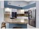 Modern kitchen featuring granite countertops, stainless steel appliances, and white cabinetry at 14801 S 8Th St, Phoenix, AZ 85048