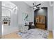 Spacious living area featuring comfortable armchairs, a stylish cabinet, and modern decor at 14801 S 8Th St, Phoenix, AZ 85048
