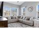 Bright living room featuring a comfortable sectional sofa, large windows, and stylish decor at 14801 S 8Th St, Phoenix, AZ 85048