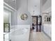 Bright main bathroom boasts a soaking tub with shower, and dual sink at 14801 S 8Th St, Phoenix, AZ 85048