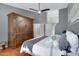 Main bedroom features a king bed, dark hardwood floors, and lots of storage at 14801 S 8Th St, Phoenix, AZ 85048