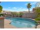 A pristine backyard pool surrounded by lush greenery offers a serene and private outdoor oasis at 14801 S 8Th St, Phoenix, AZ 85048