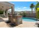 Backyard with a built-in grill, covered patio, and refreshing in-ground pool provides a relaxing outdoor space at 14801 S 8Th St, Phoenix, AZ 85048