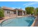Beautiful backyard pool with a spa, covered patio, and built-in grill, perfect for entertaining and outdoor relaxation at 14801 S 8Th St, Phoenix, AZ 85048