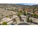 Aerial view of homes with tile roofs nestled in a desert community with mountain views at 15020 S 25Th St, Phoenix, AZ 85048